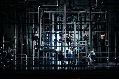a maze of pipes fills the Bord Gais Theatre stage with 3 singers and 6 aerialists seen swinging on the pipes